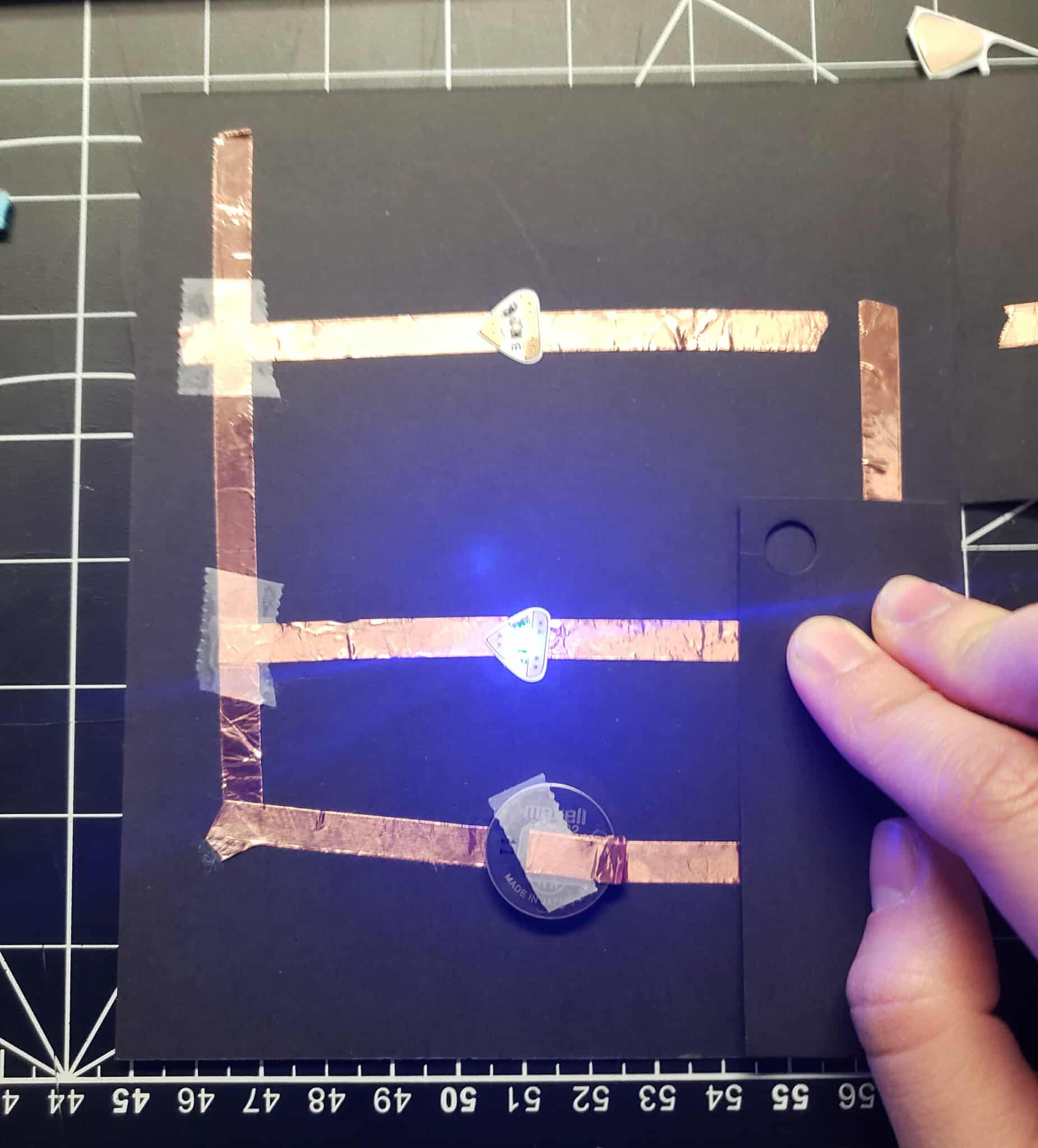 The bottom light is turned on by closing the bottom flap