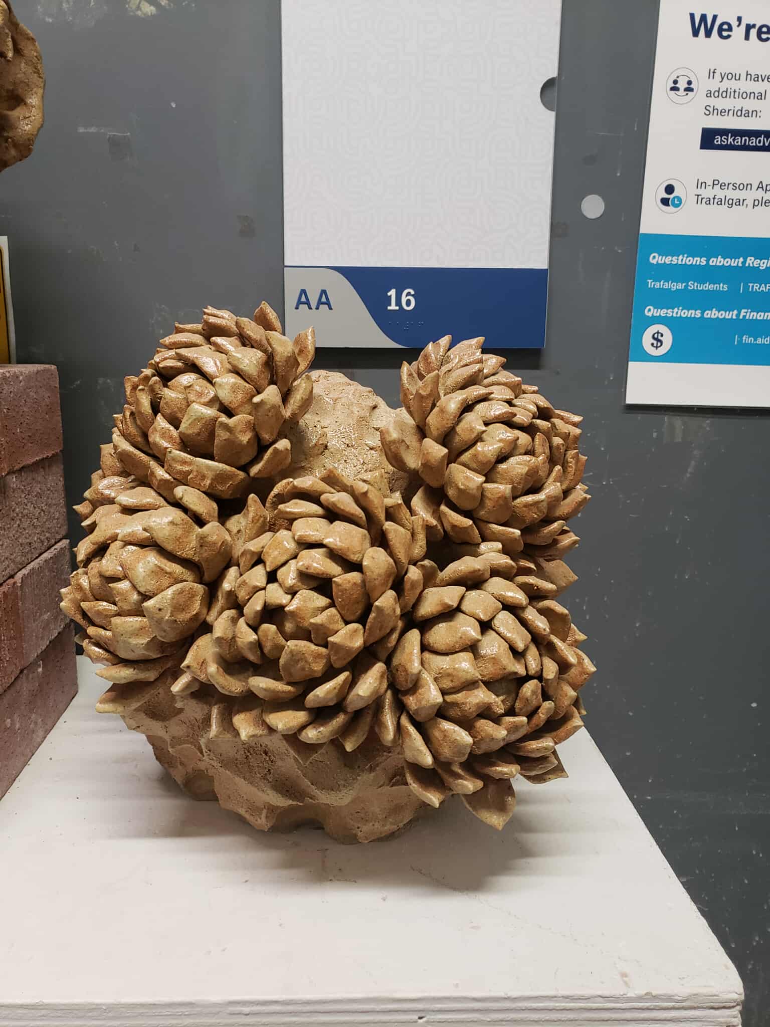 I found this in the hallway of the ceramic class. It is made of some type of baked clay